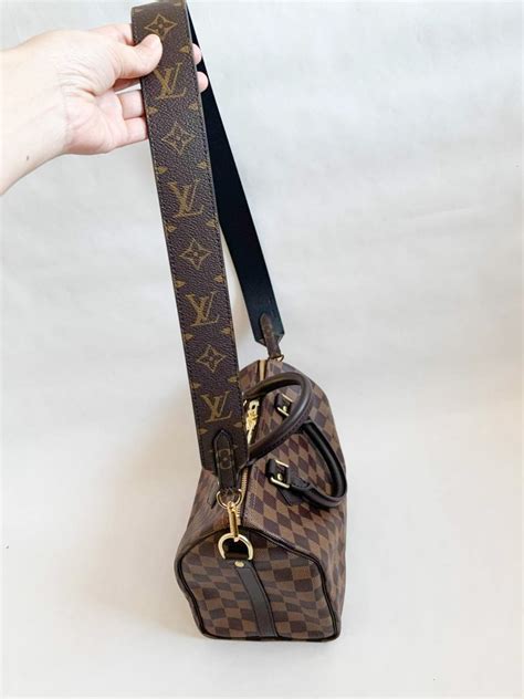 louis vuitton pouch with strap.